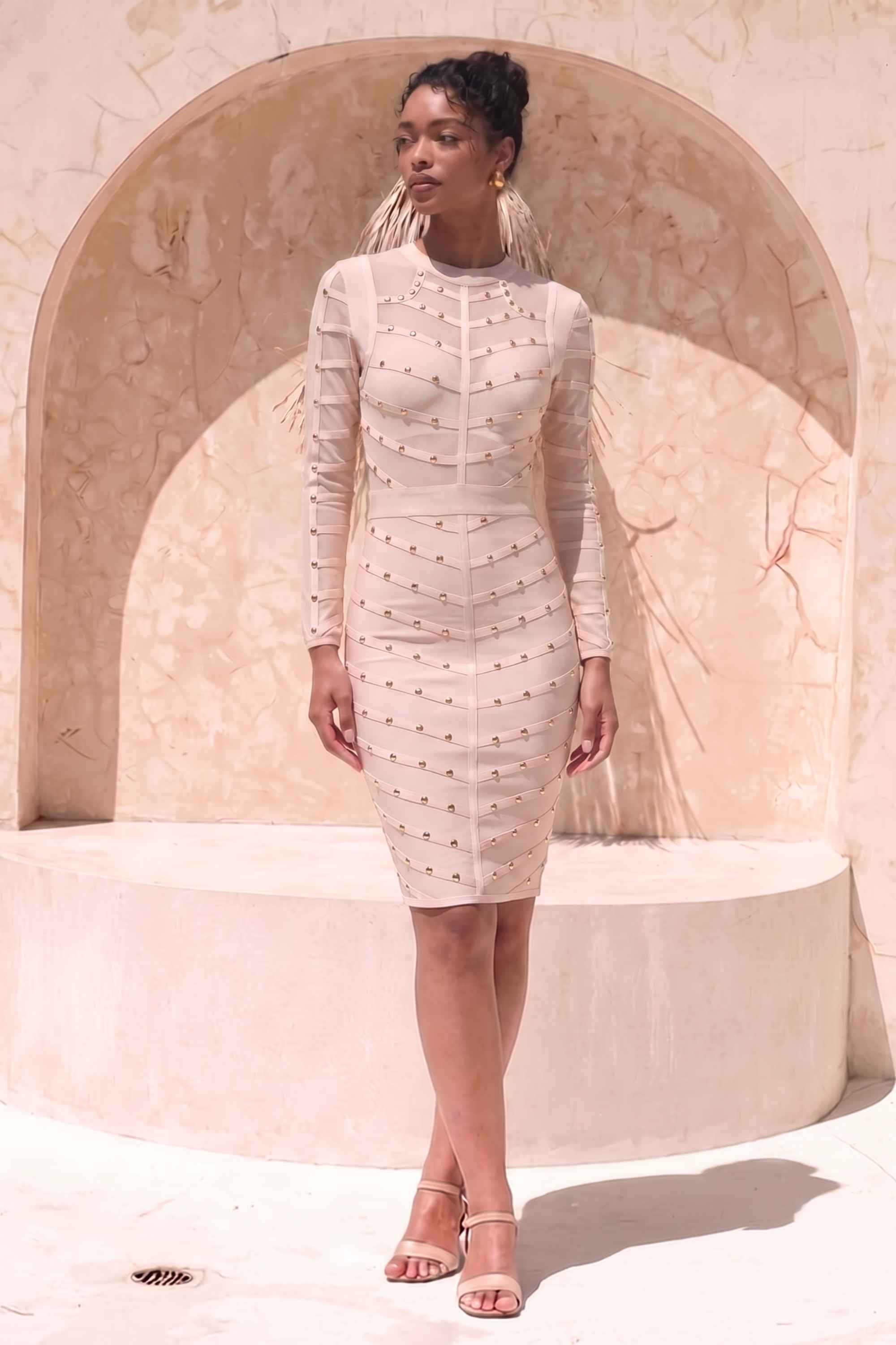Woman wearing a figure flattering Rosa Long Sleeve Bodycon Dress - Cream BODYCON COLLECTION
