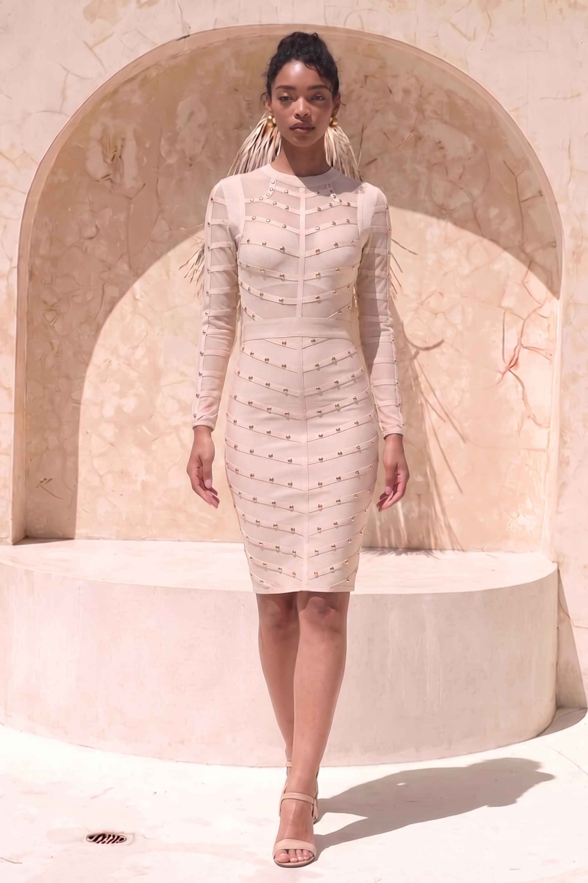 Woman wearing a figure flattering Rosa Long Sleeve Bodycon Dress - Cream BODYCON COLLECTION