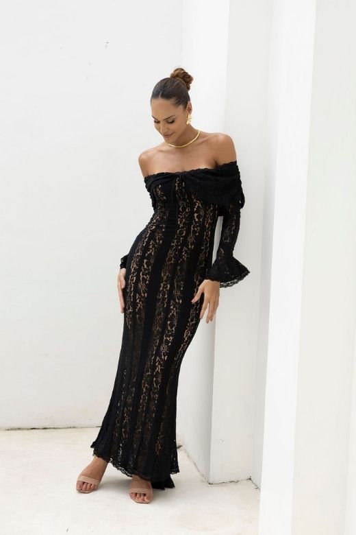 Woman wearing a figure flattering Rose Long Sleeve Bodycon Maxi Dress - Classic Black BODYCON COLLECTION