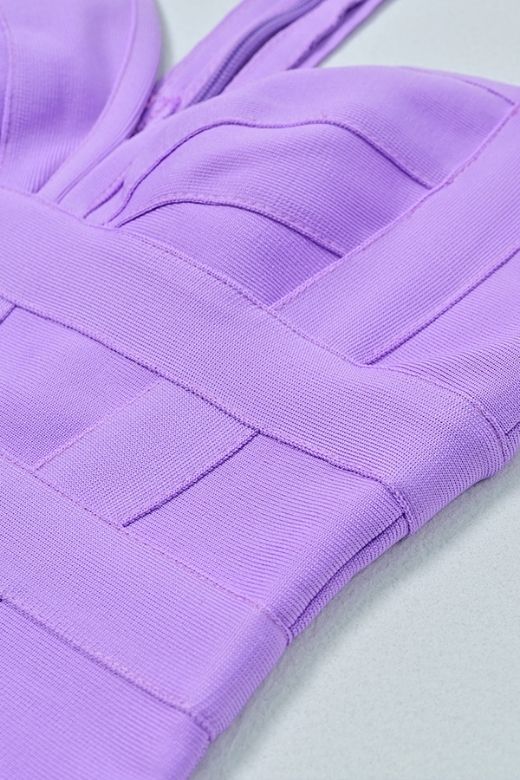 Woman wearing a figure flattering Ruby Bandage Mini Dress - Violet Purple BODYCON COLLECTION
