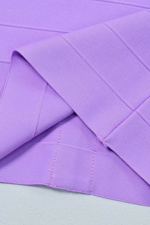 Woman wearing a figure flattering Ruby Bandage Mini Dress - Violet Purple BODYCON COLLECTION