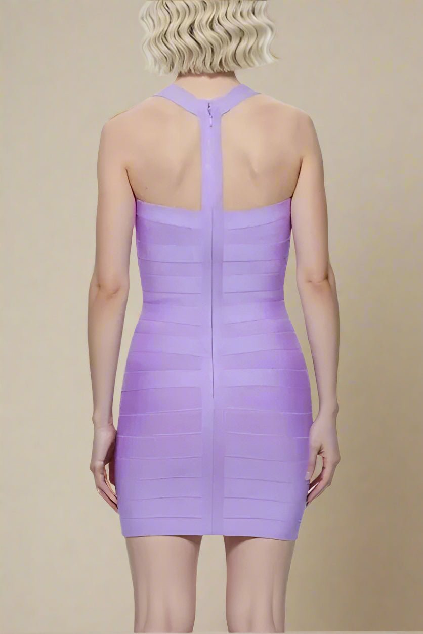 Woman wearing a figure flattering Ruby Bandage Mini Dress - Violet Purple BODYCON COLLECTION