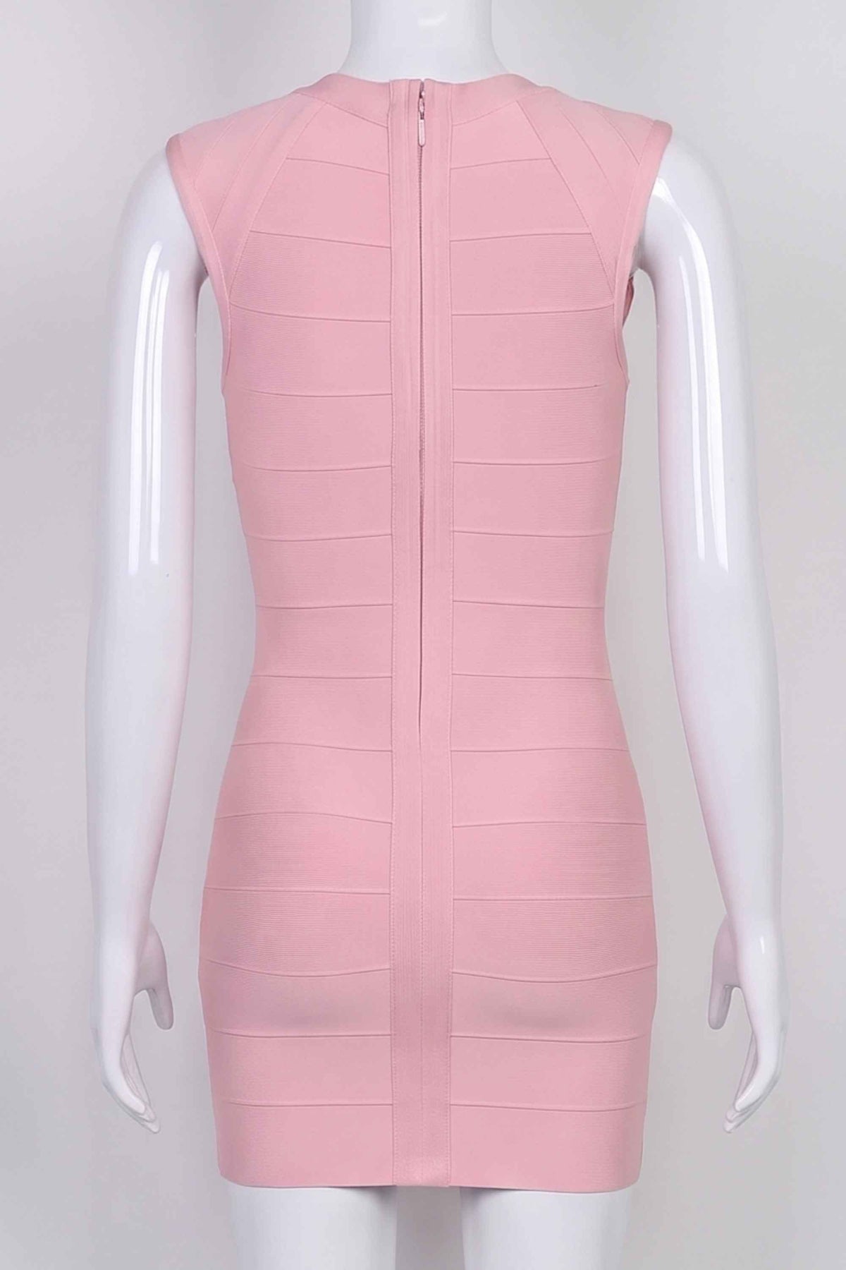 Woman wearing a figure flattering Sabrina Bandage Mini Dress - Pale Pink BODYCON COLLECTION Pty Ltd