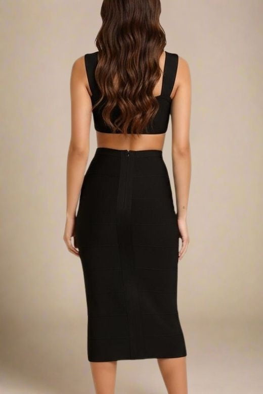 Woman wearing a figure flattering Sasha Bandage Midi Dress - Classic Black BODYCON COLLECTION
