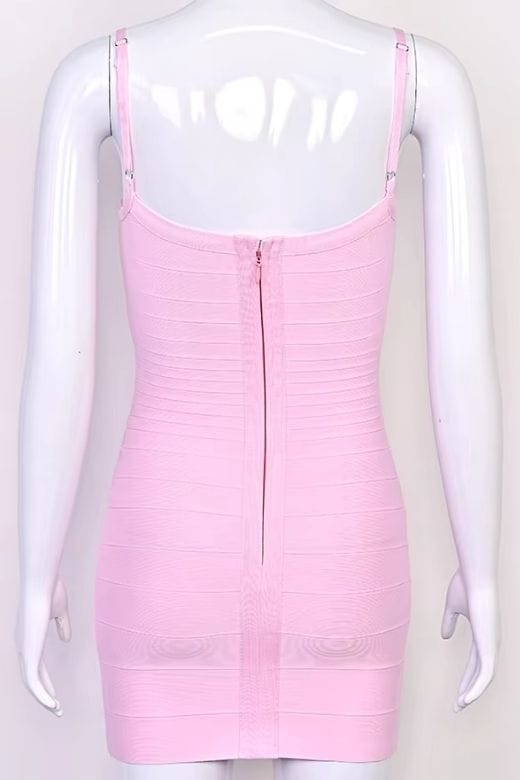 Woman wearing a figure flattering Scarlett Bandage Mini Dress - Dusty Pink BODYCON COLLECTION Pty Ltd