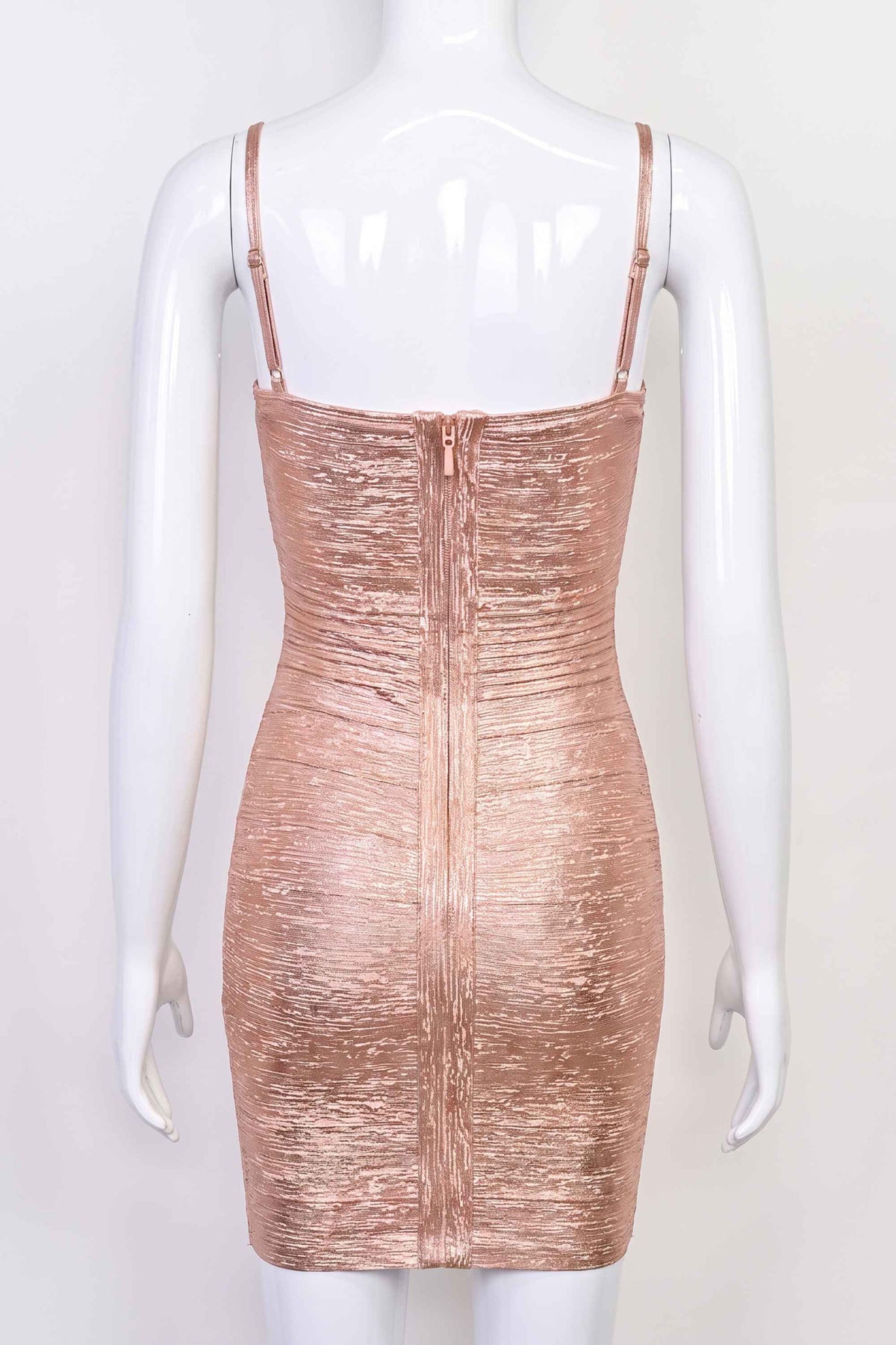 Woman wearing a figure flattering Scarlett Bandage Mini Dress - Rose Gold BODYCON COLLECTION Pty Ltd