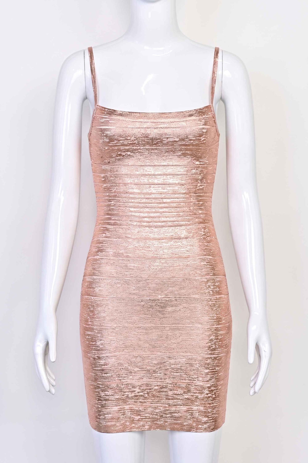 Woman wearing a figure flattering Scarlett Bandage Mini Dress - Rose Gold BODYCON COLLECTION Pty Ltd