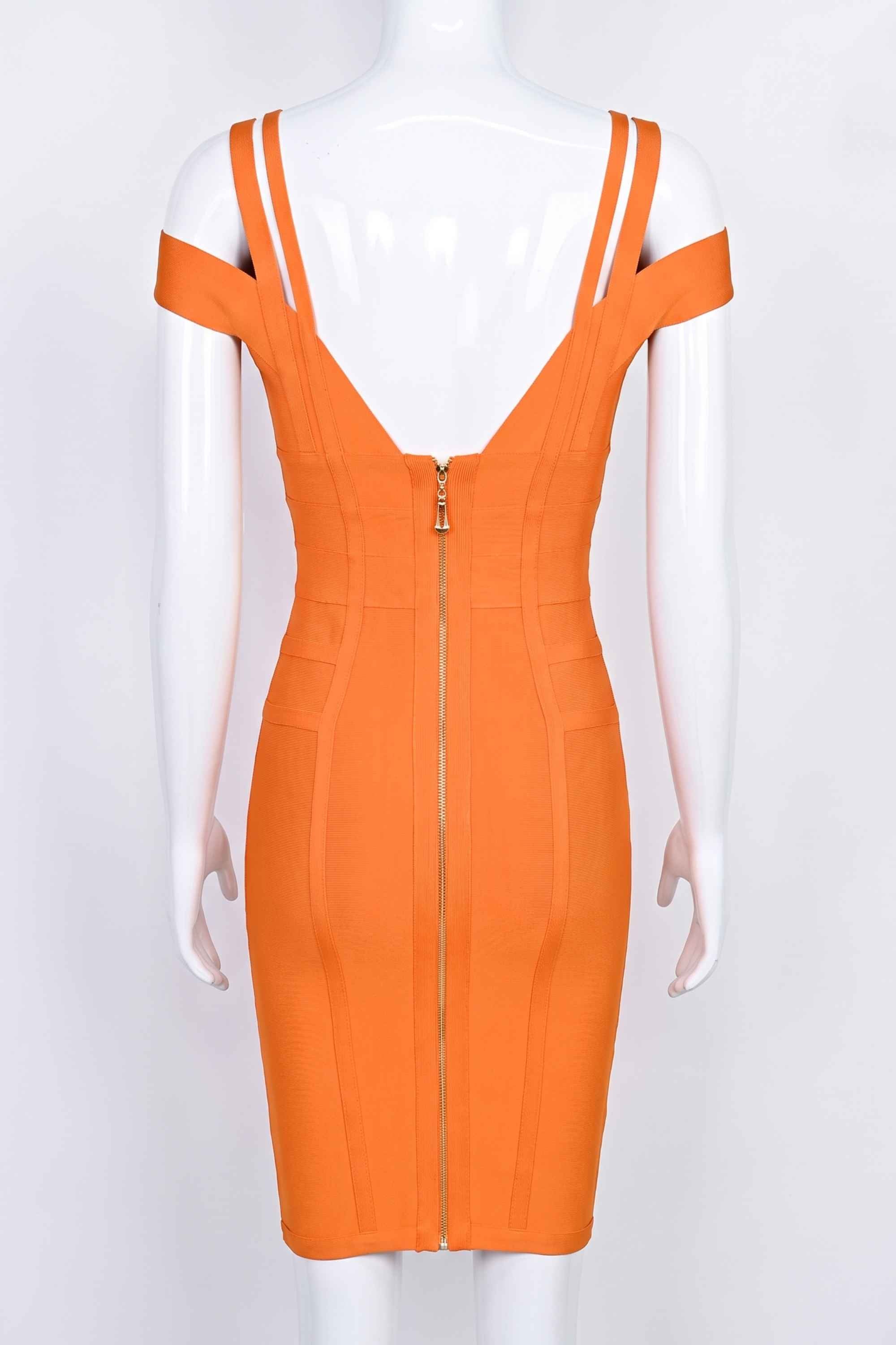 Woman wearing a figure flattering Sia Bandage Dress - Apricot Orange Bodycon Collection