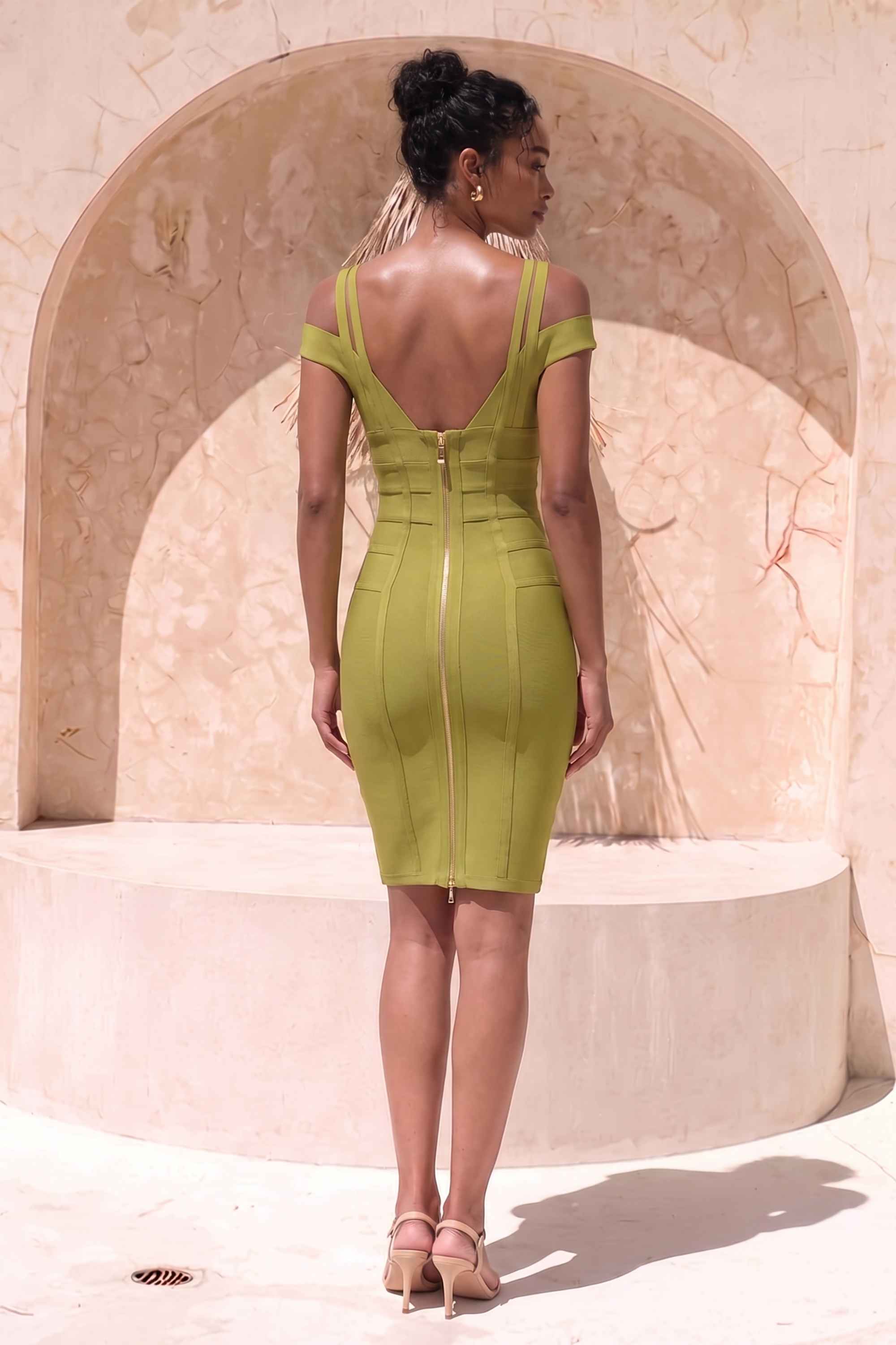Woman wearing a figure flattering Sia Bandage Dress - Olive Green Bodycon Collection