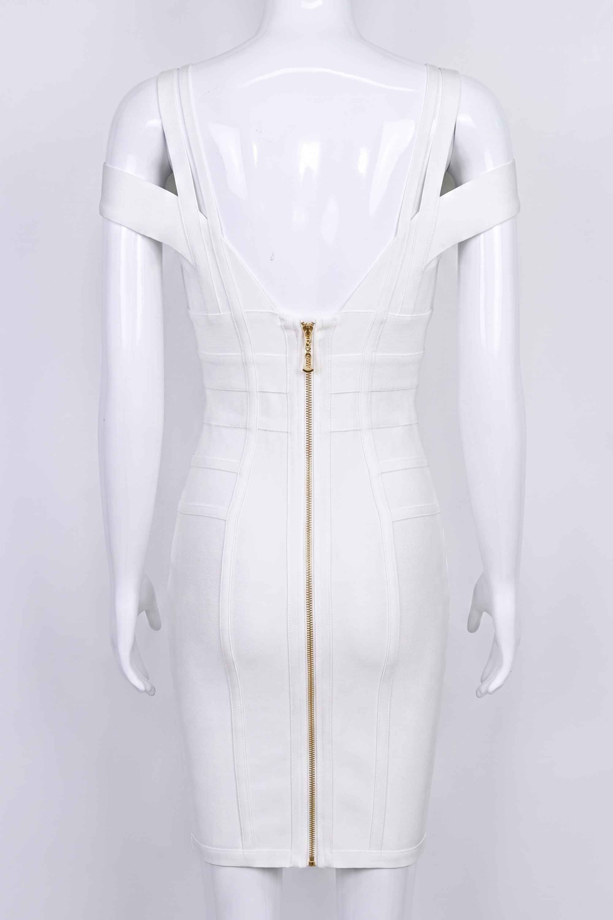 Woman wearing a figure flattering Sia Bandage Dress - Pearl White Bodycon Collection