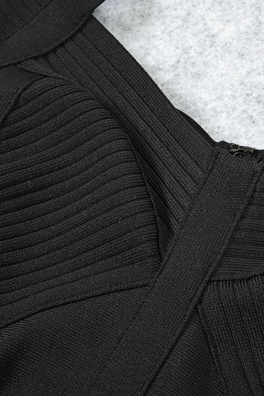 Woman wearing a figure flattering Sophia Bandage Mini Dress - Classic Black Bodycon Collection