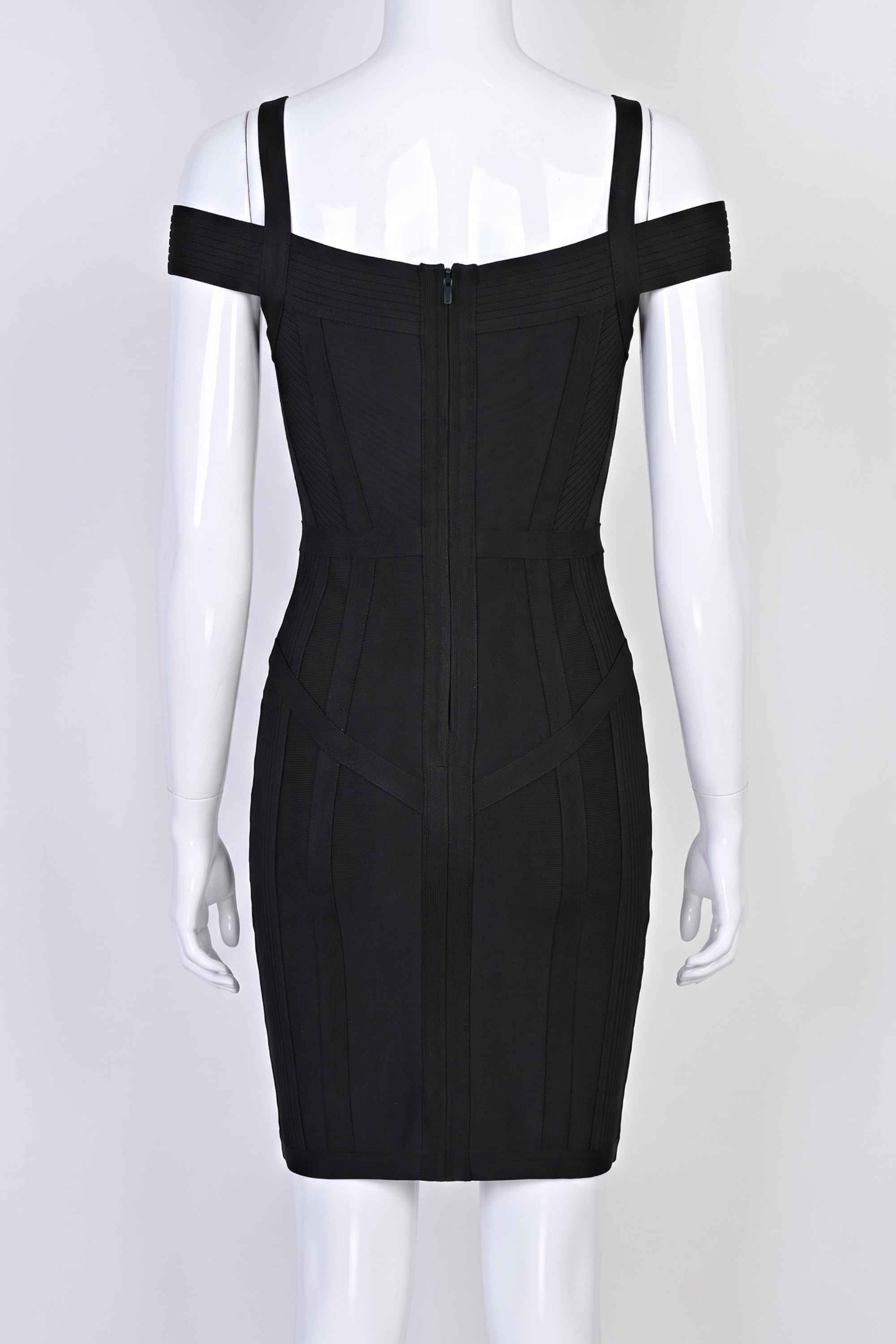 Woman wearing a figure flattering Sophia Bandage Mini Dress - Classic Black Bodycon Collection