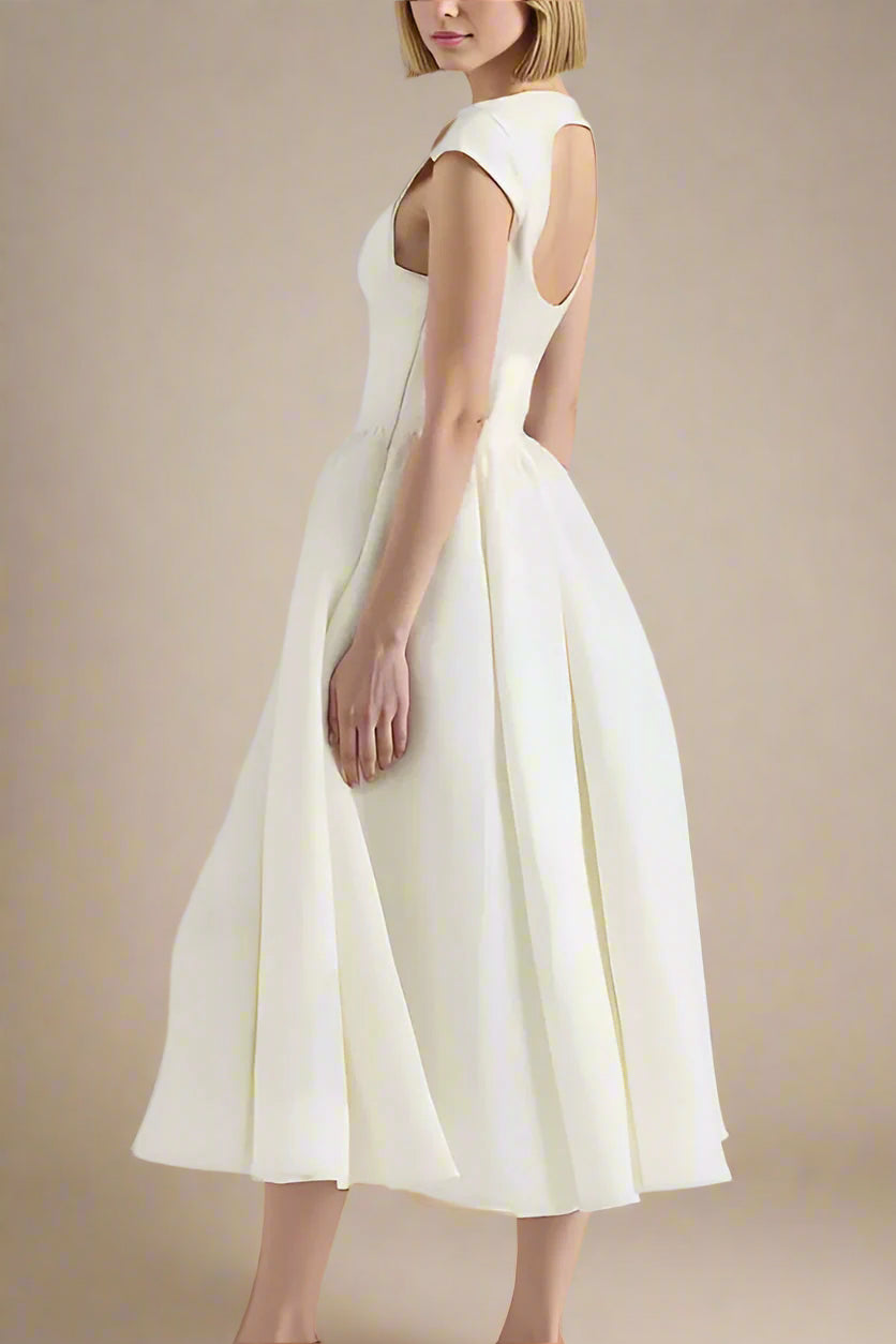 Woman wearing a figure flattering Stella Bodycon Midi Dress - White Pearl BODYCON COLLECTION