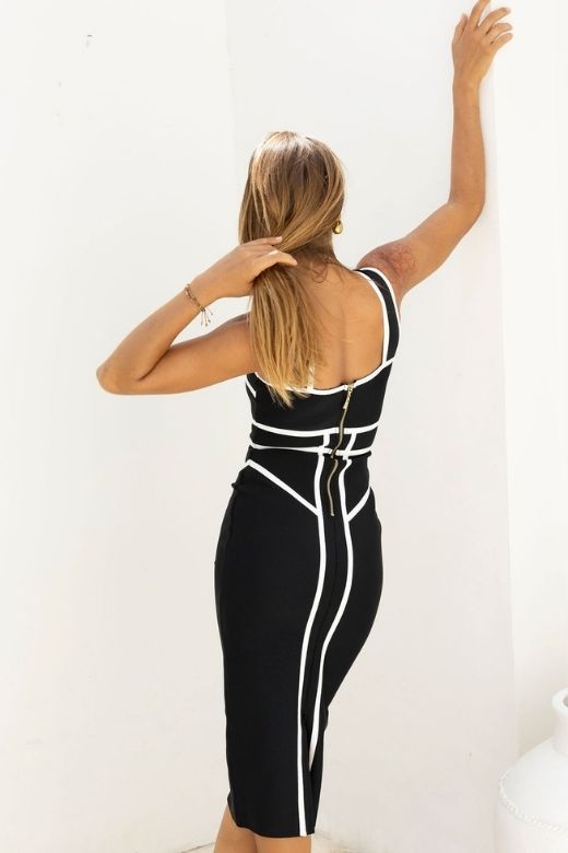 Woman wearing a figure flattering Suki Bandage Midi Dress - Classic Black BODYCON COLLECTION