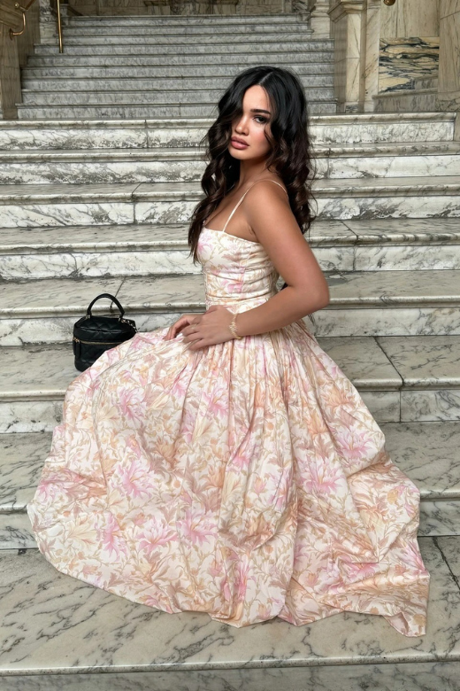 Woman wearing a figure flattering Tasmin Midi Dress - Pink Print BODYCON COLLECTION
