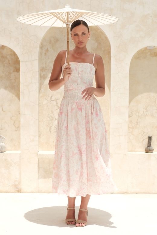 Woman wearing a figure flattering Tasmin Midi Dress - Pink Print BODYCON COLLECTION