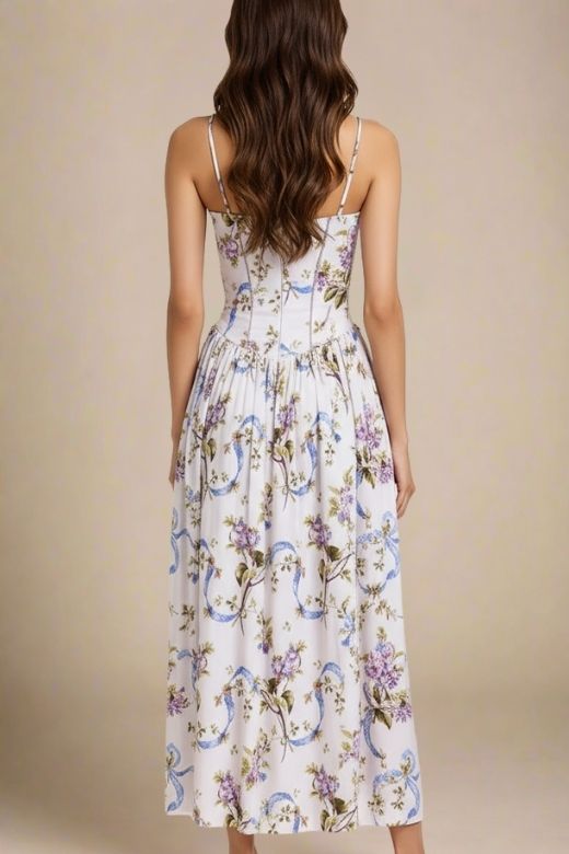 Woman wearing a figure flattering Tasmin Midi Dress - White Floral BODYCON COLLECTION