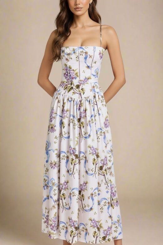 Woman wearing a figure flattering Tasmin Midi Dress - White Floral BODYCON COLLECTION