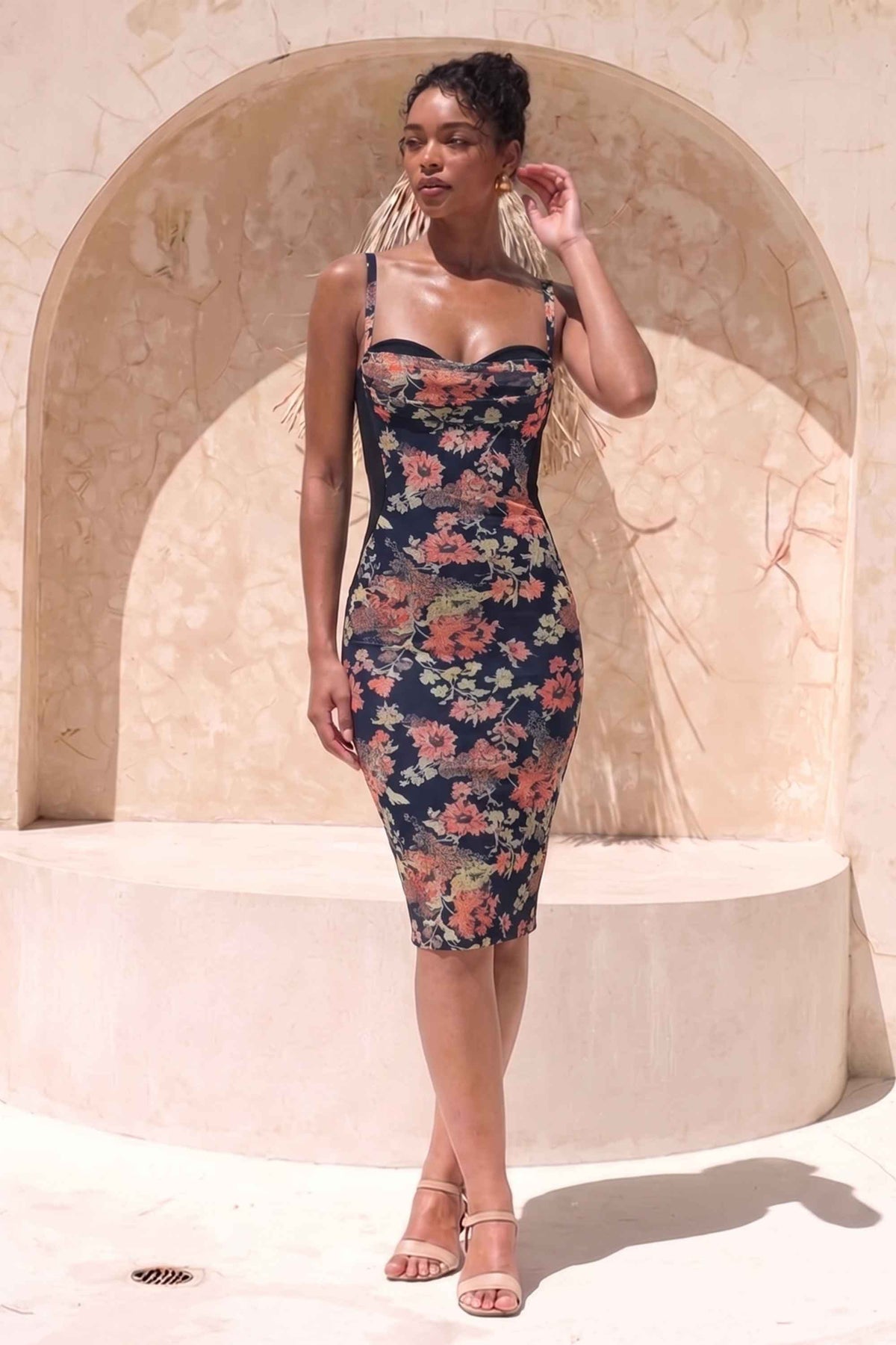 Woman wearing a figure flattering Tate Bodycon Wrap Dress - Classic Black BODYCON COLLECTION Pty Ltd