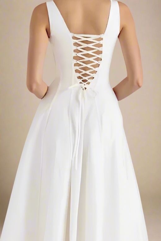 Woman wearing a figure flattering Willa Midi Dress - White Pearl BODYCON COLLECTION Pty Ltd