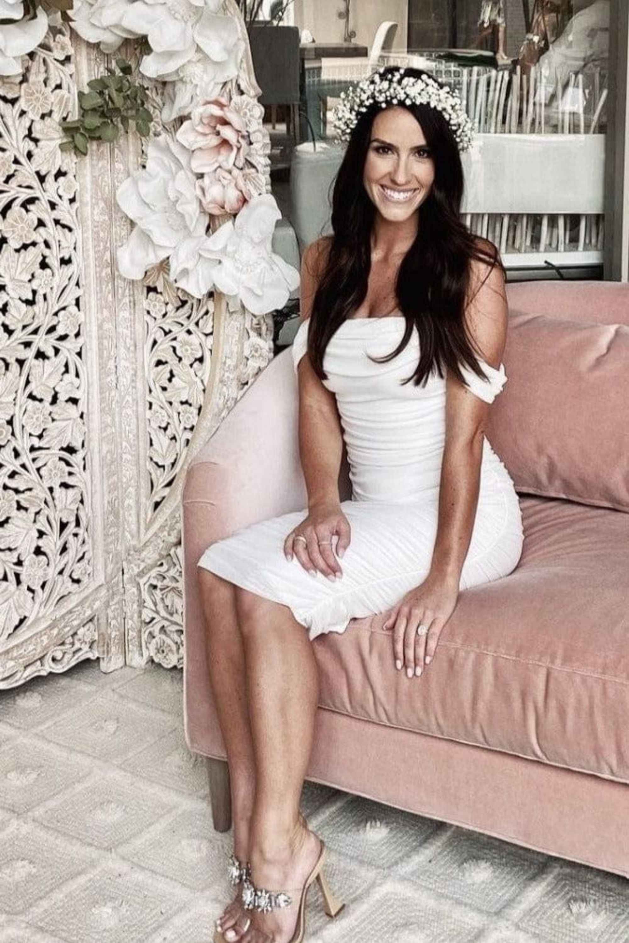 Woman wearing a figure flattering Zia Bodycon Wrap Midi Dress - Pearl White Bodycon Collection
