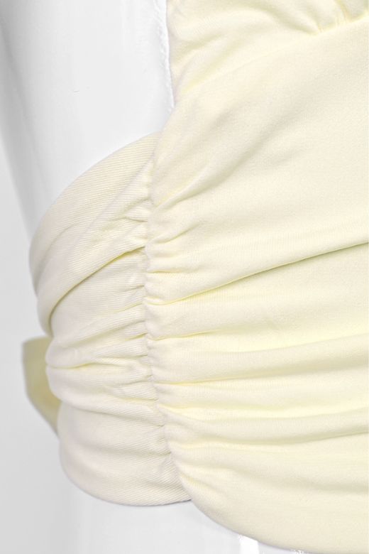 Woman wearing a figure flattering  Aby Halter Top - Butter Yellow BODYCON COLLECTION Pty Ltd