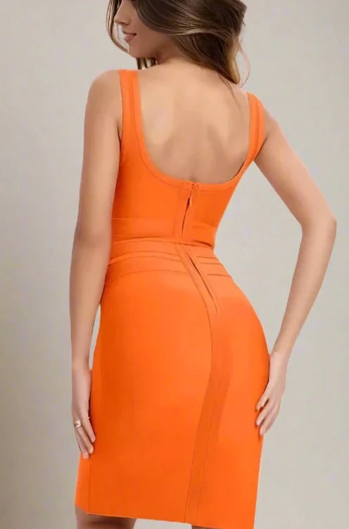 Woman wearing a figure flattering  Amy Bandage Dress - Apricot Orange Bodycon Collection