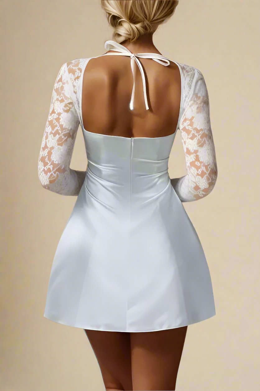 Woman wearing a figure flattering  Andy Long Sleeve Mini Dress - Pearl White BODYCON COLLECTION