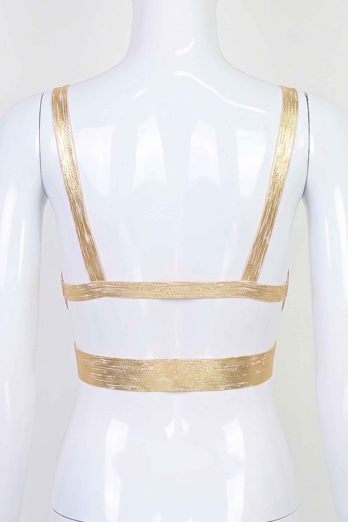 Woman wearing a figure flattering  Ang Bandage Crop Top - Gold BODYCON COLLECTION