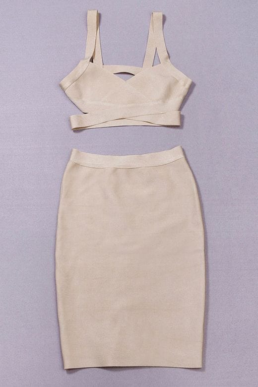 Woman wearing a figure flattering  Ang Bandage Top and Knee Length Skirt Set- Cream BODYCON COLLECTION