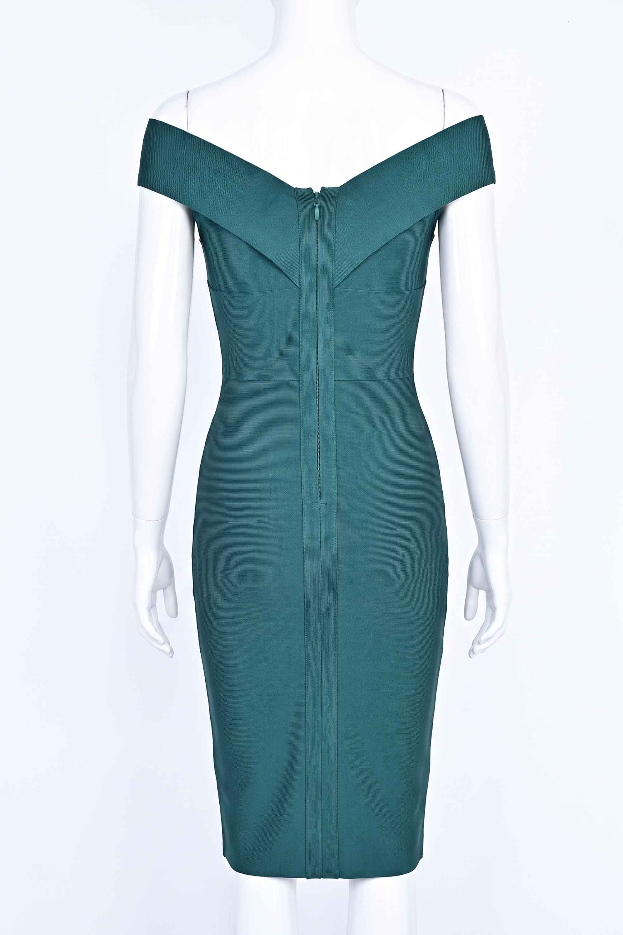 Woman wearing a figure flattering  Ash Bandage Dress - Emerald Green Bodycon Collection