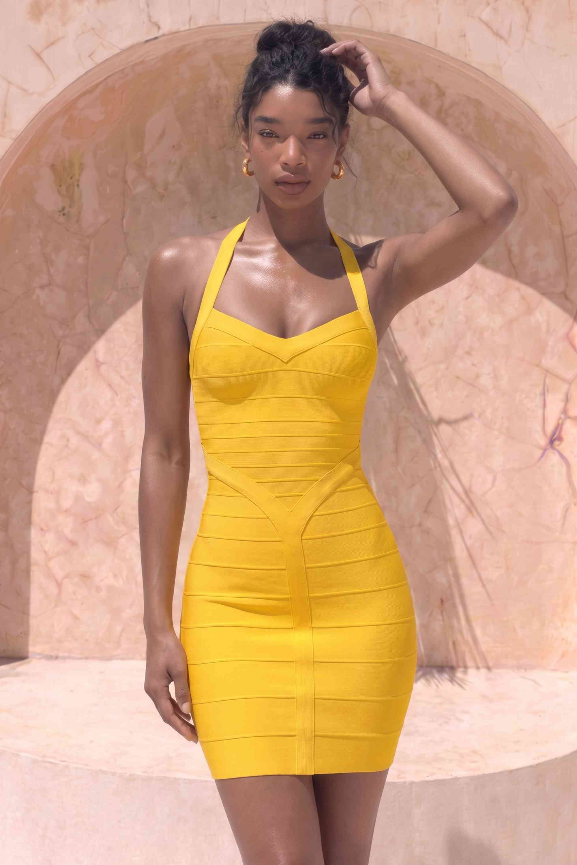 Woman wearing a figure flattering  Athena Bandage Mini Dress - Mustard Yellow BODYCON COLLECTION Pty Ltd