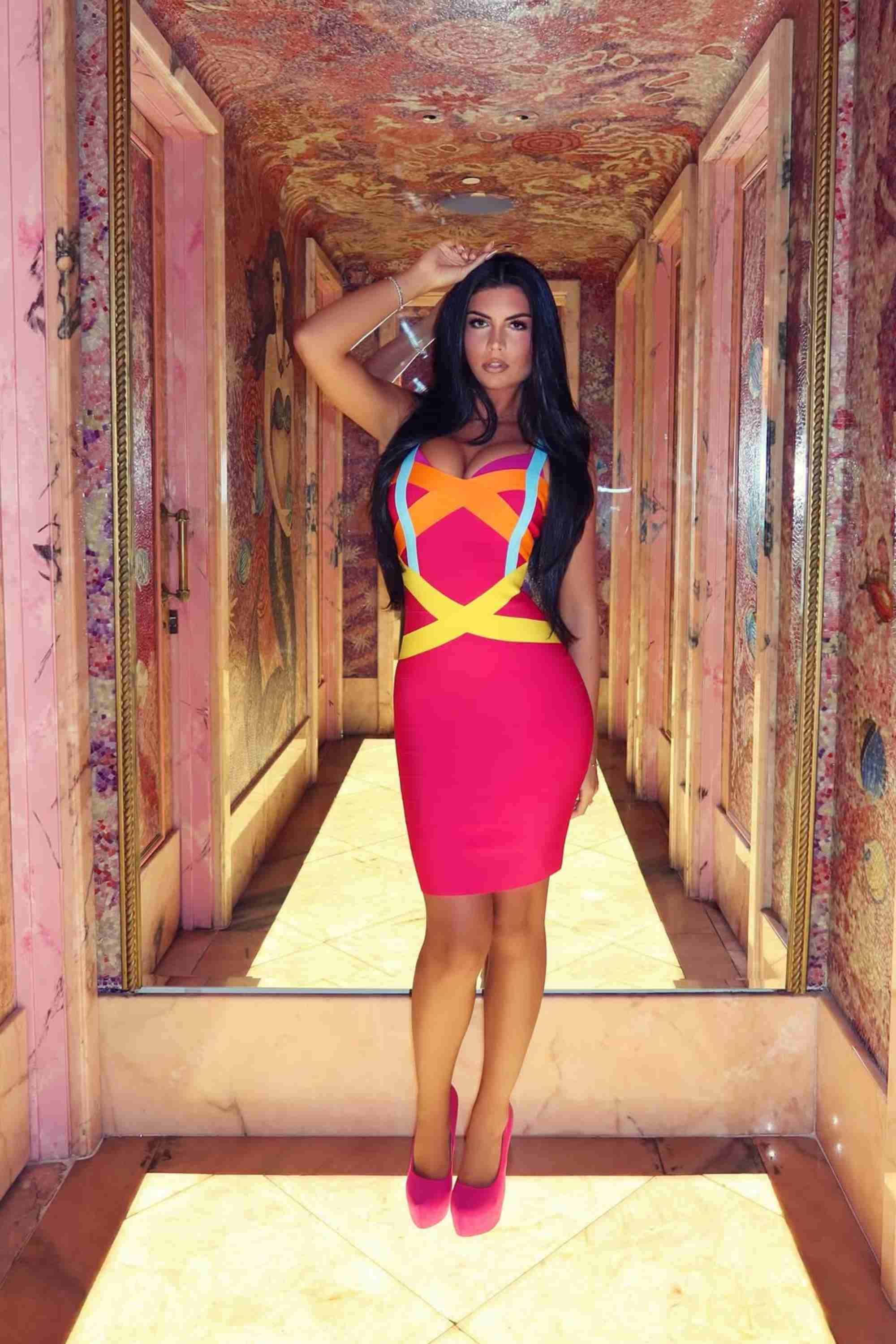 Woman wearing a figure flattering  Heidi Bandage Mini Dress - Hot Pink (Sale) Bodycon Collection