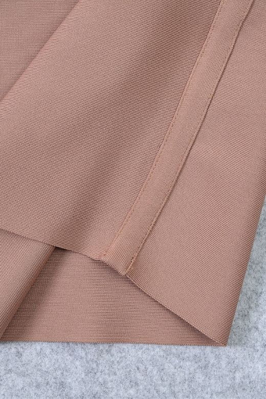 Woman wearing a figure flattering  Bay Bandage Dress - Nude Bodycon Collection