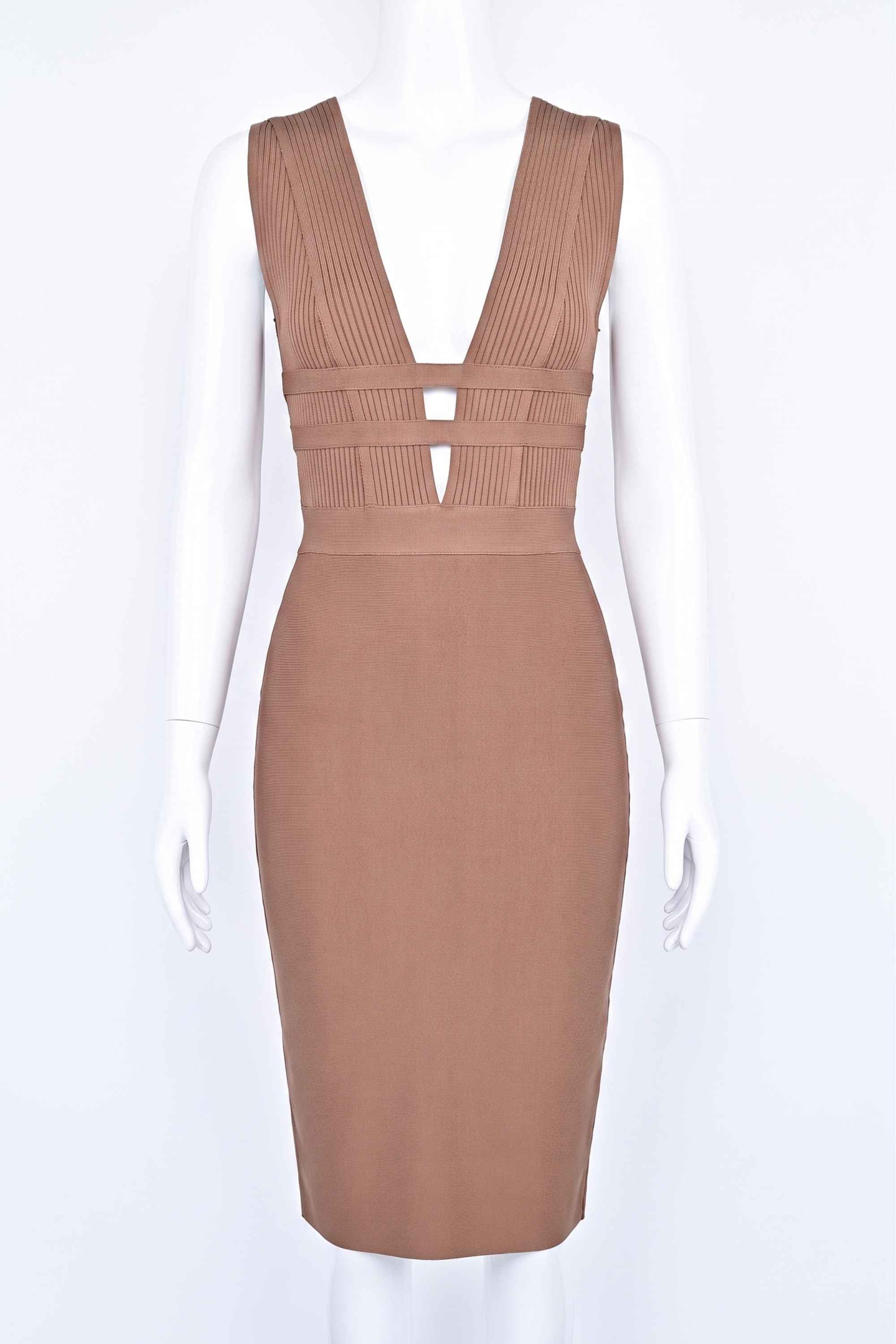 Woman wearing a figure flattering  Bay Bandage Dress - Nude Bodycon Collection
