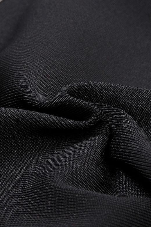 Woman wearing a figure flattering  Beth Bandage Dress - Classic Black BODYCON COLLECTION