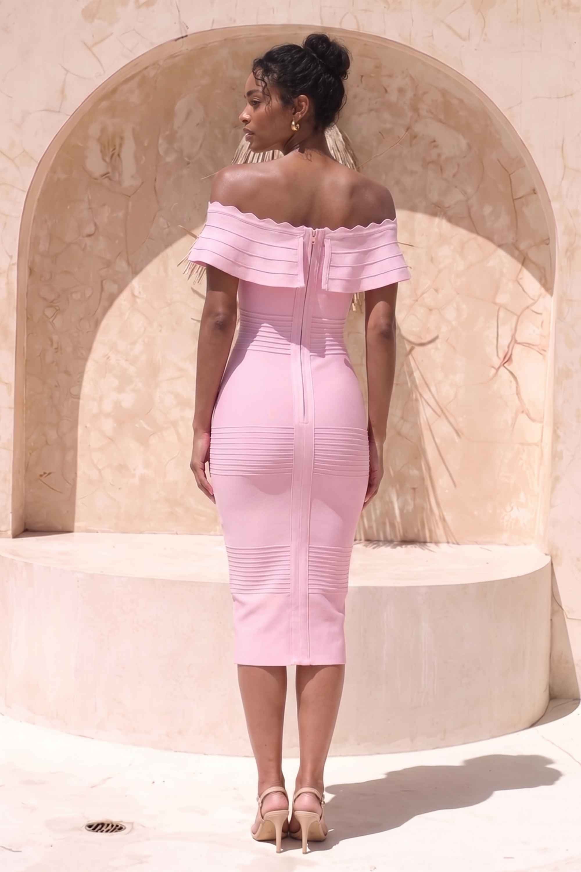 Woman wearing a figure flattering  Billie Bandage Midi Dress - Dusty Pink Bodycon Collection