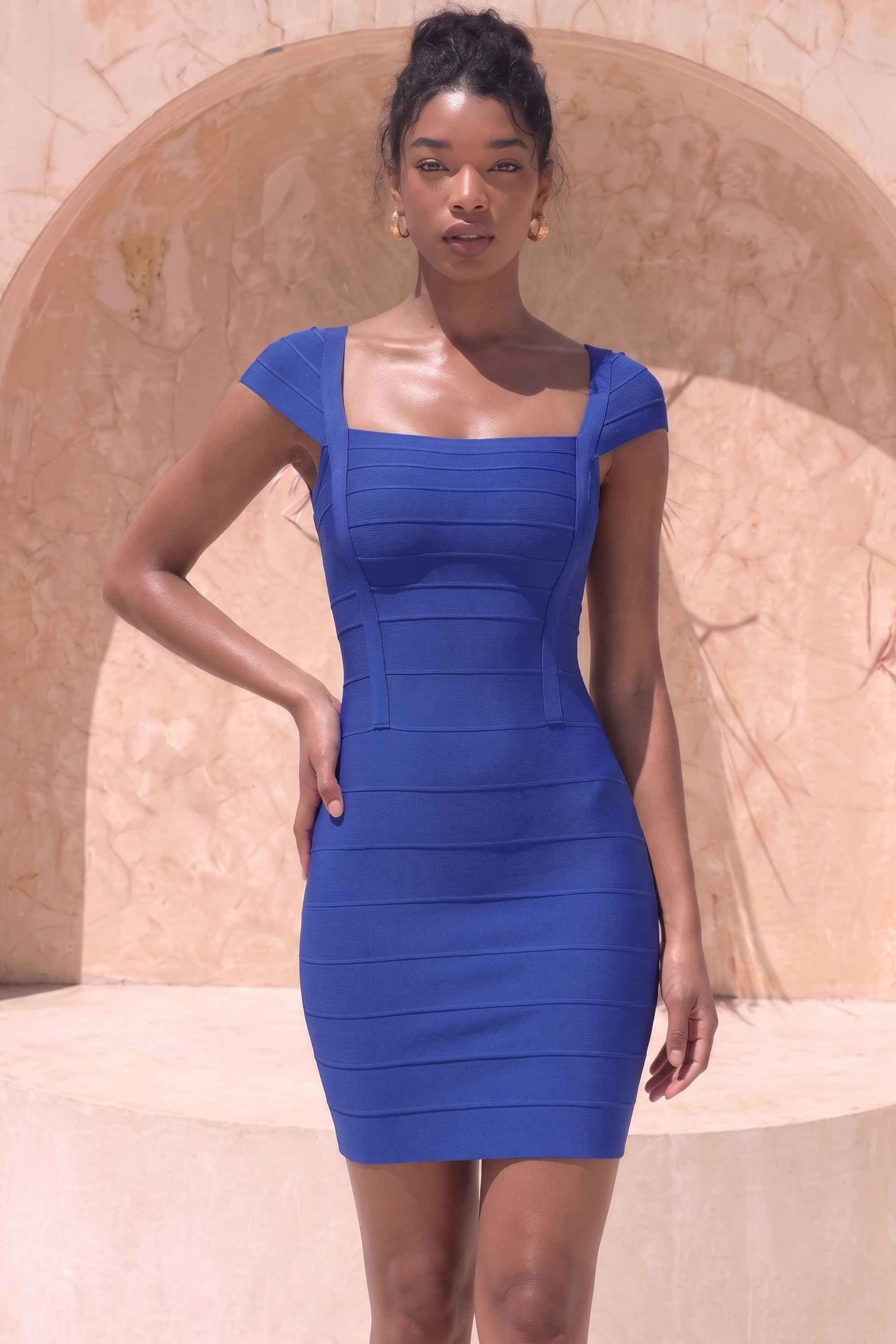 Woman wearing a figure flattering  Celine Bandage Mini Dress - Navy Blue BODYCON COLLECTION Pty Ltd
