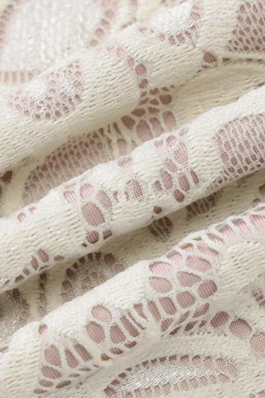 Woman wearing a figure flattering  Charlotte Long Sleeve Bodycon Mini Dress - Cream BODYCON COLLECTION