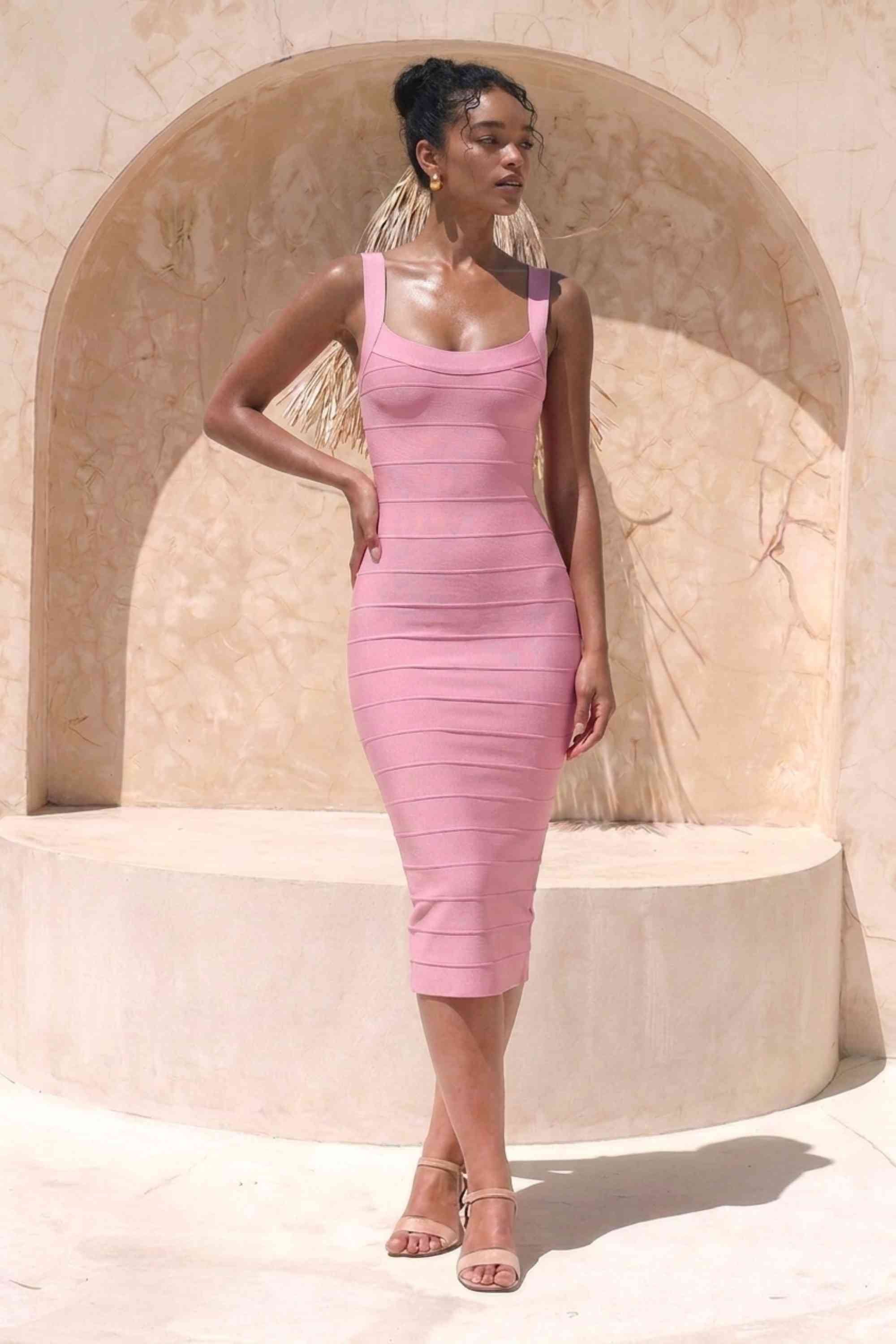 Woman wearing a figure flattering  Cindy Bandage Midi Dress - Blush Pink BODYCON COLLECTION Pty Ltd