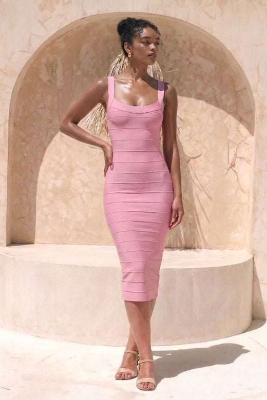 Woman wearing a figure flattering  Cindy Bandage Midi Dress - Blush Pink BODYCON COLLECTION Pty Ltd