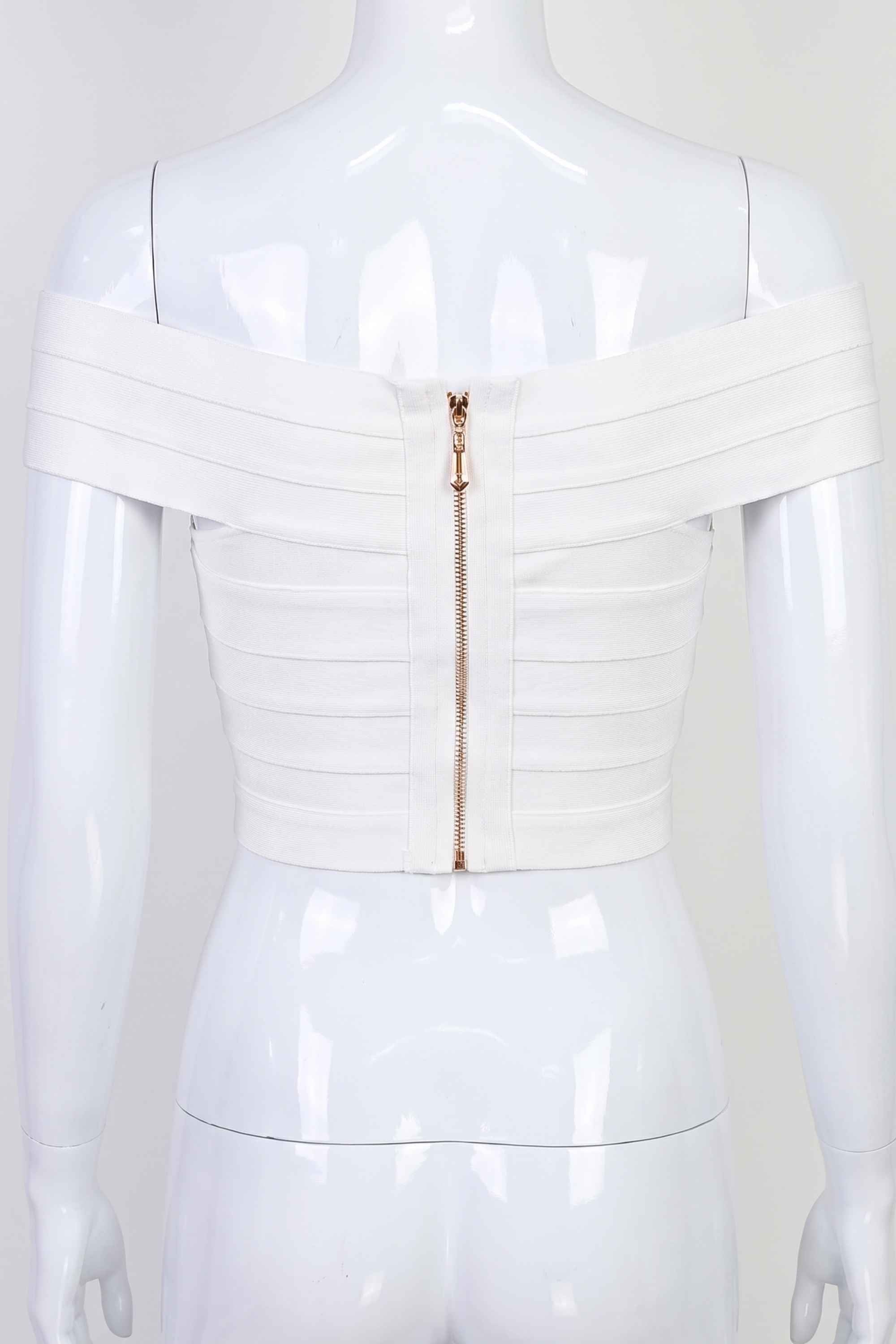 Woman wearing a figure flattering  Cindy Bandage Off Shoulder Crop Top - Pearl White BODYCON COLLECTION
