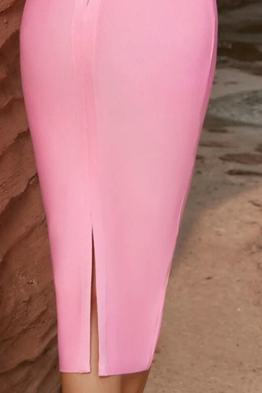 Woman wearing a figure flattering  Ellen Bandage Dress - Dusty Pink BODYCON COLLECTION