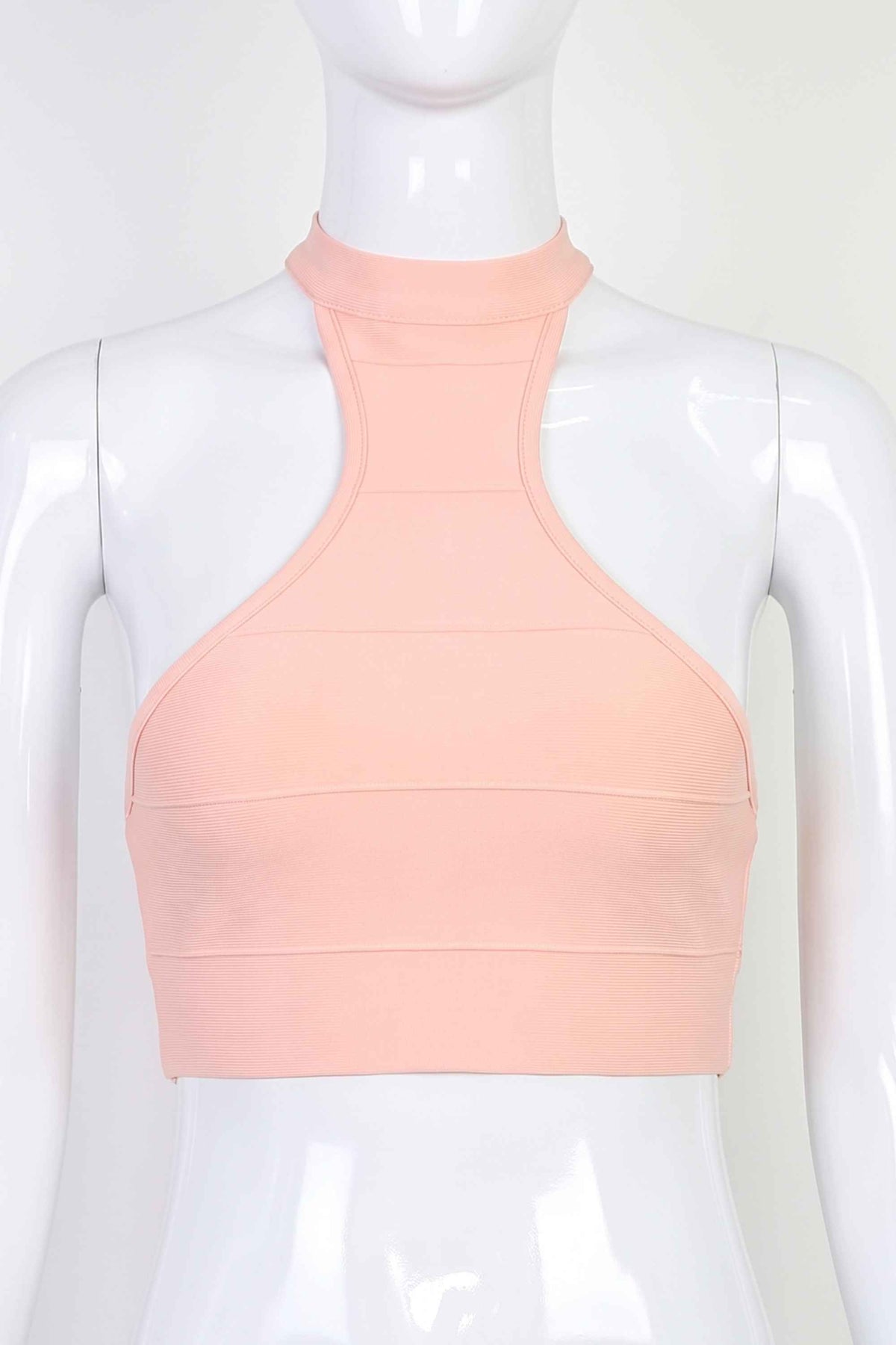 Woman wearing a figure flattering  Elli Bandage Crop Top - Dusty Pink BODYCON COLLECTION