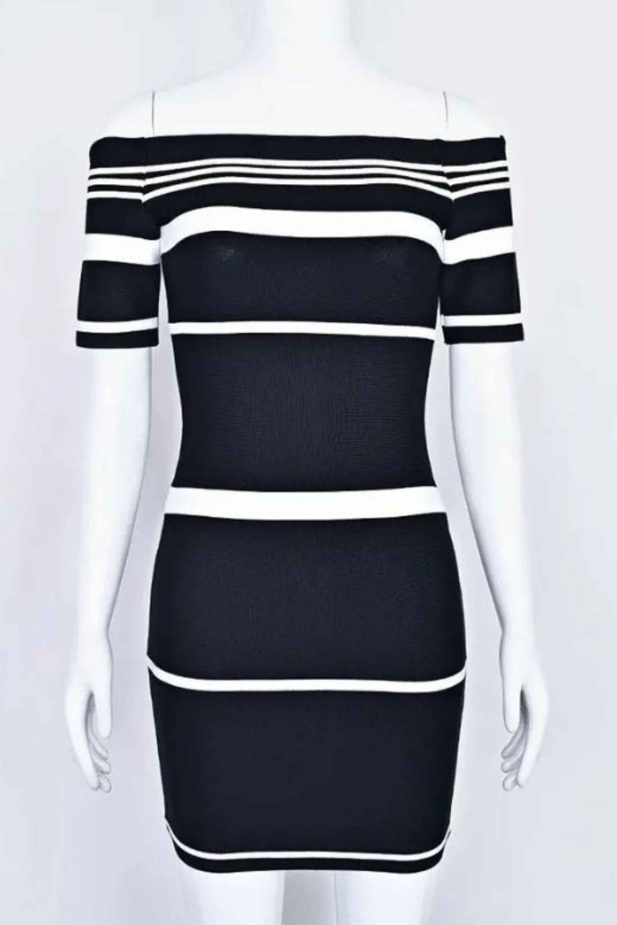 Woman wearing a figure flattering  Evelyn Bandage Mini Dress - Classic Black BODYCON COLLECTION Pty Ltd