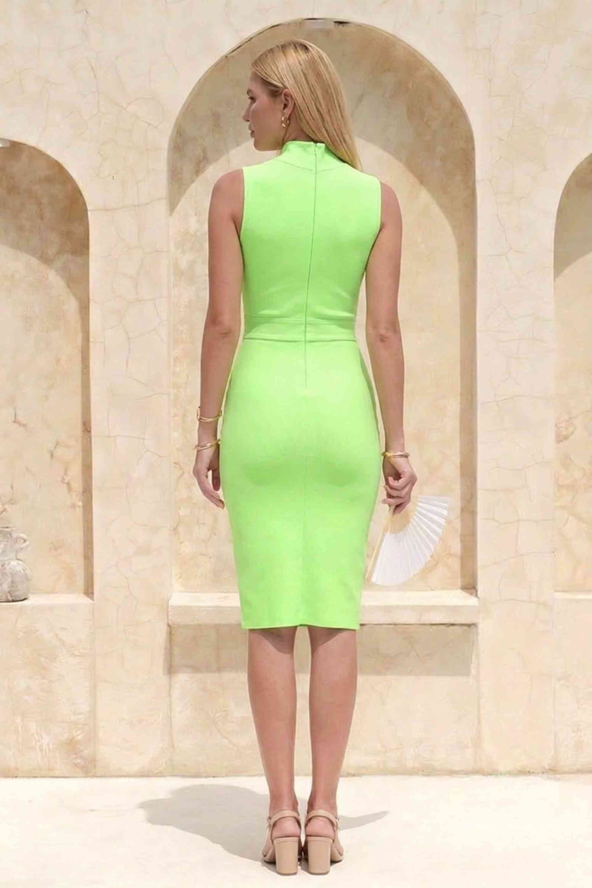 Woman wearing a figure flattering  Grace Bandage Midi Dress - Neon Green Bodycon Collection