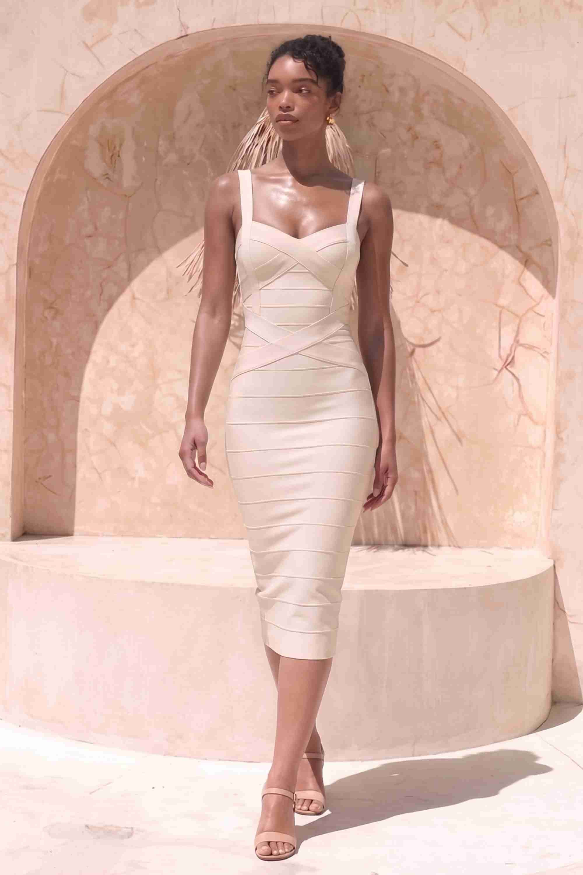 Woman wearing a figure flattering cream party dress Heidi Bandage Midi Dress - Cream Bodycon Collection