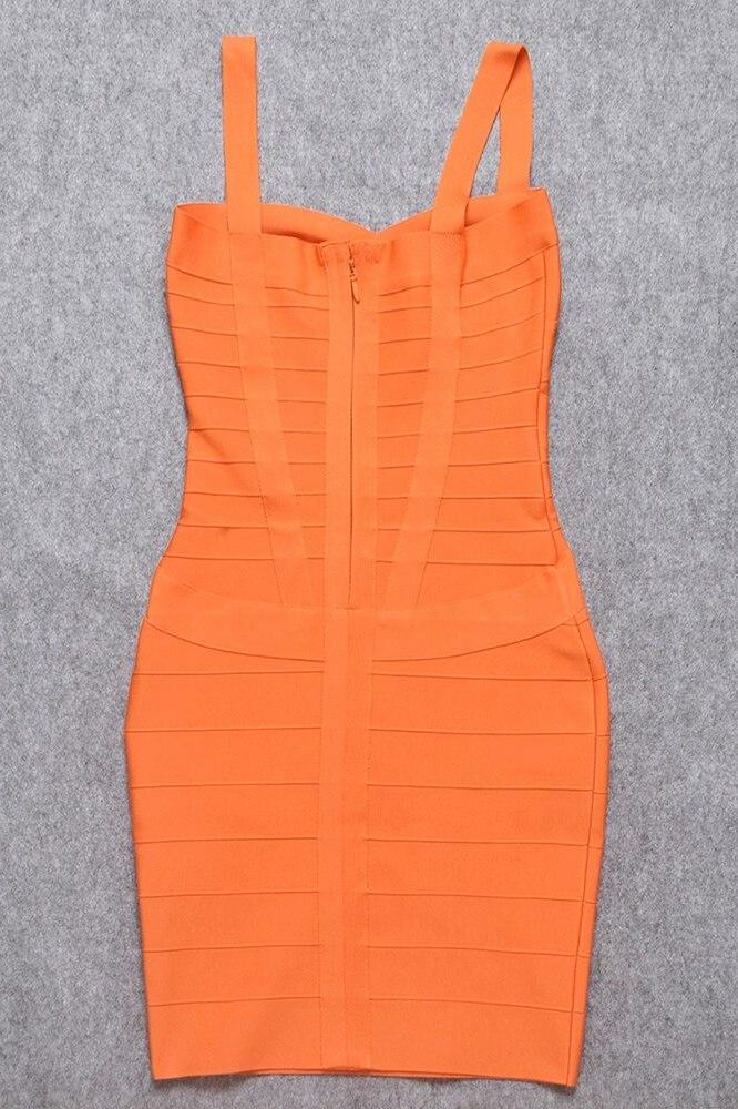Woman wearing a figure flattering  Heidi Bandage Mini Dress - Apricot Orange Bodycon Collection