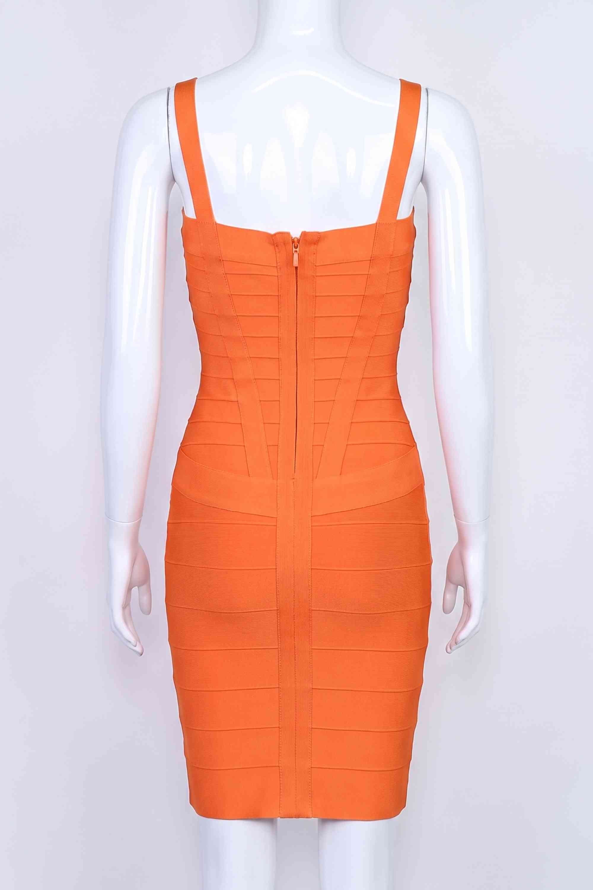 Woman wearing a figure flattering  Heidi Bandage Mini Dress - Apricot Orange Bodycon Collection
