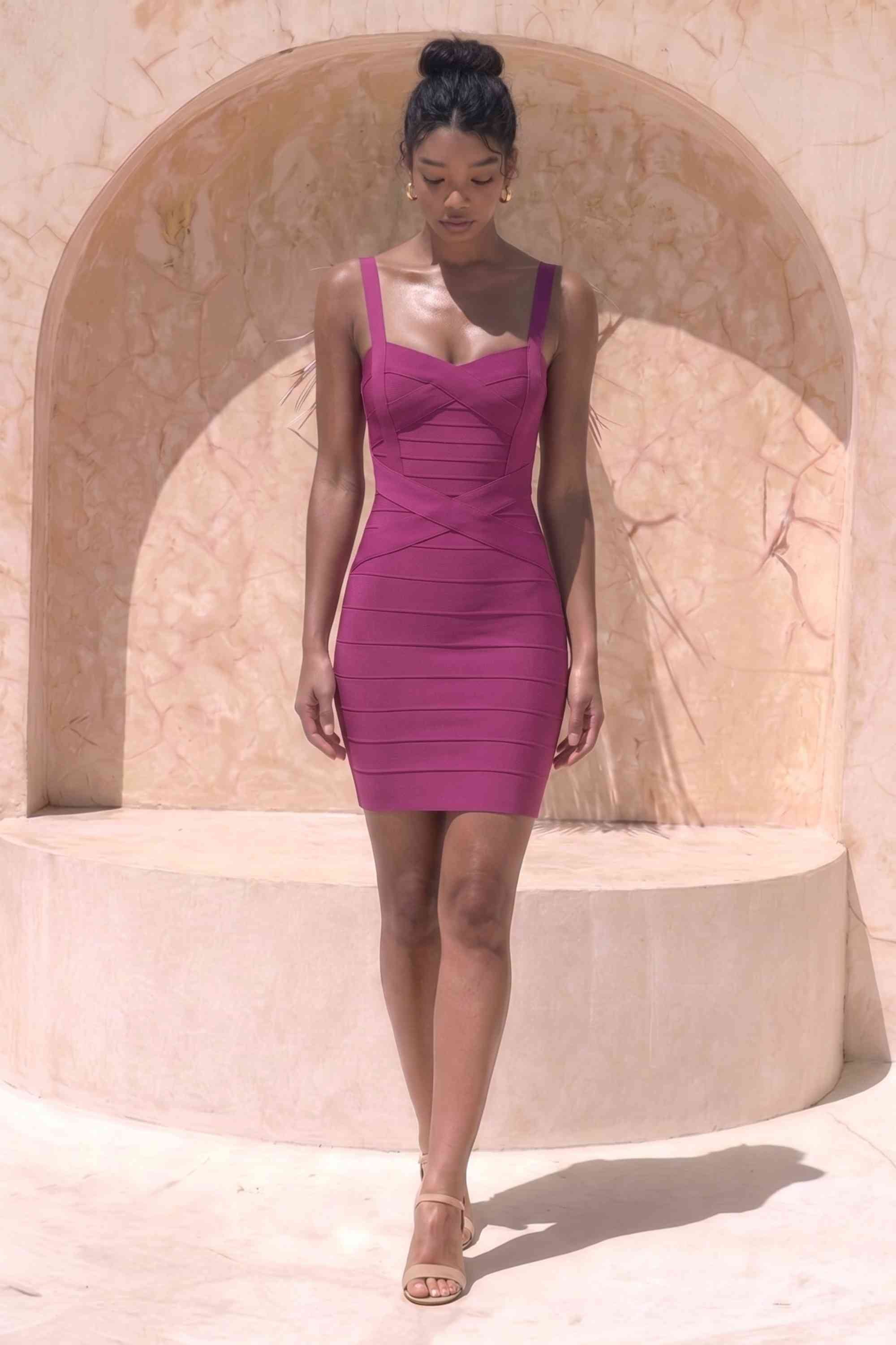 Woman wearing a figure flattering  Heidi Bandage Mini Dress - Magenta Pink Bodycon Collection